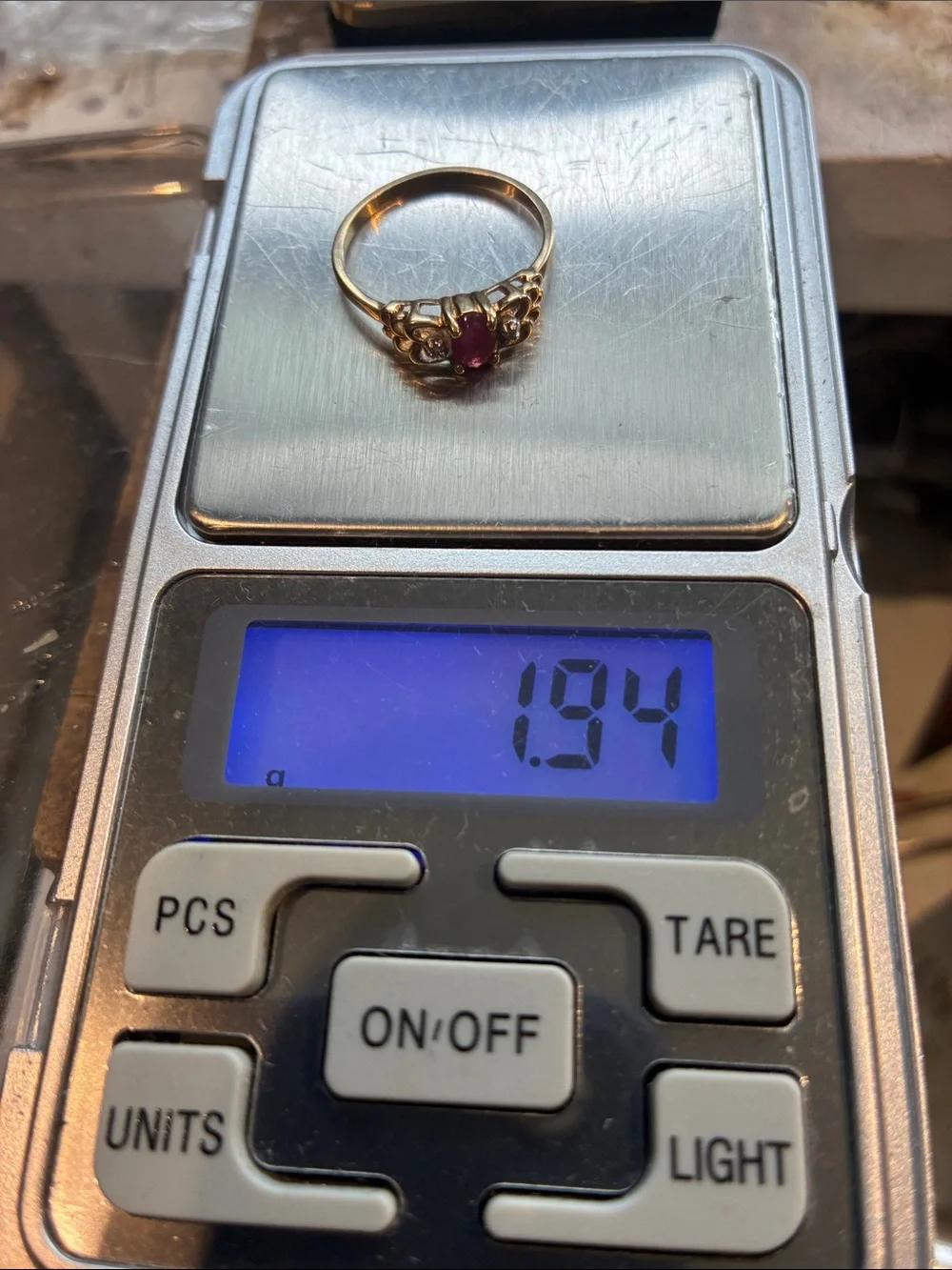 10K Gold Ring with Ruby Center Stone and Diamonds. 1.95 Grams      Size 8